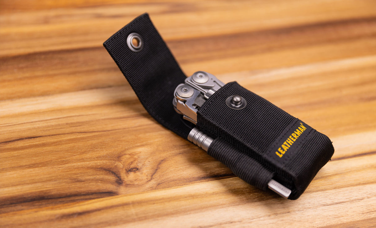 Translation missing: en.Black nylon Leatherman sheath carrying Leatherman ratchet driver and Leatherman tool