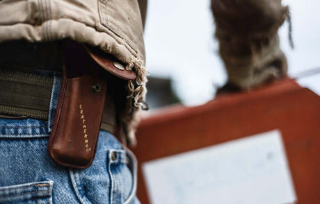 Translation missing: en.Brown Leatherman Heritage Sheath attached to a belt, showcasing accessories for versatile multi-tool use