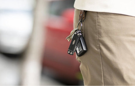 Translation missing: en.Leatherman Micra keychain multi-tool attached to a set of keys clipped to a pocket, highlighting compact gift options under $50
