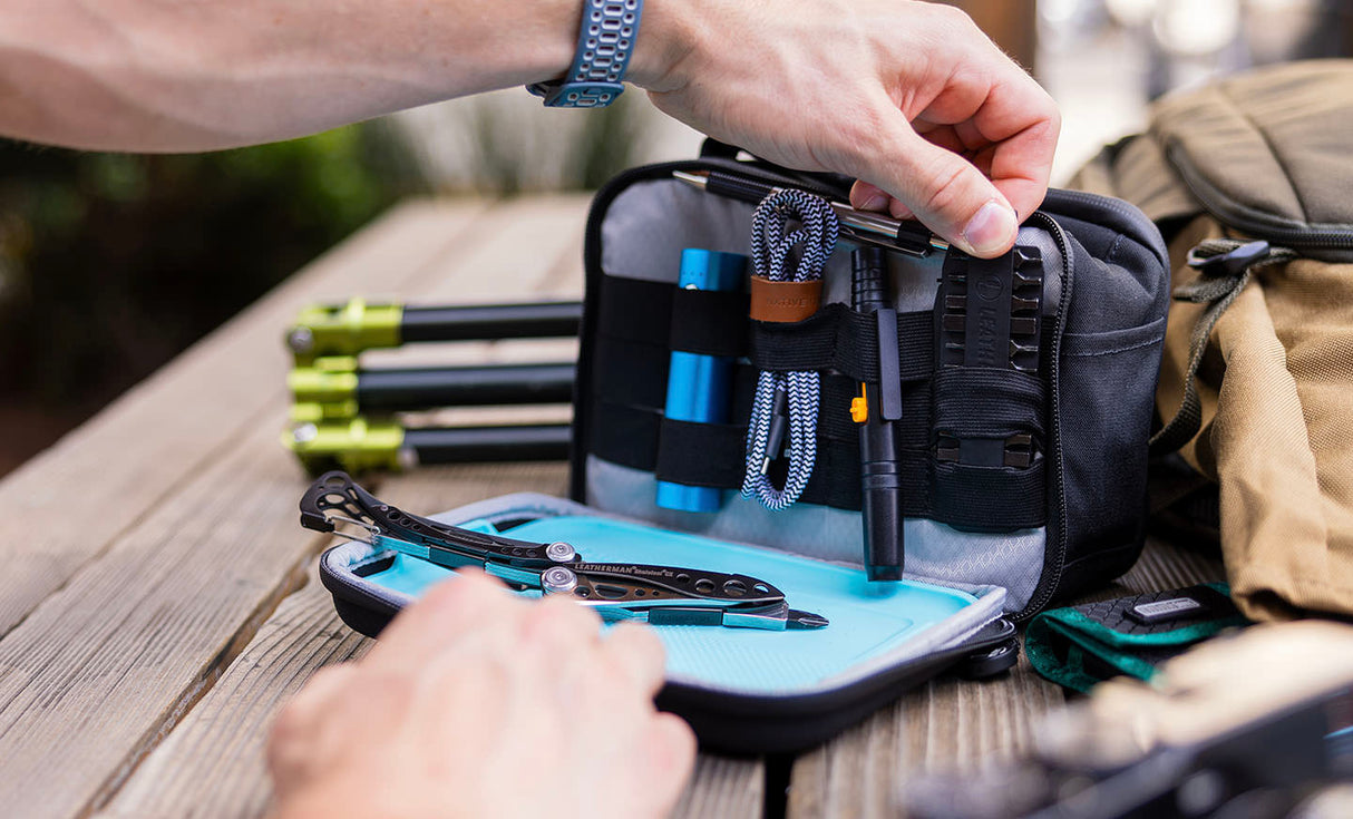 Translation missing: en.Man pulling bit kit from Leatherman® Adapt Kit