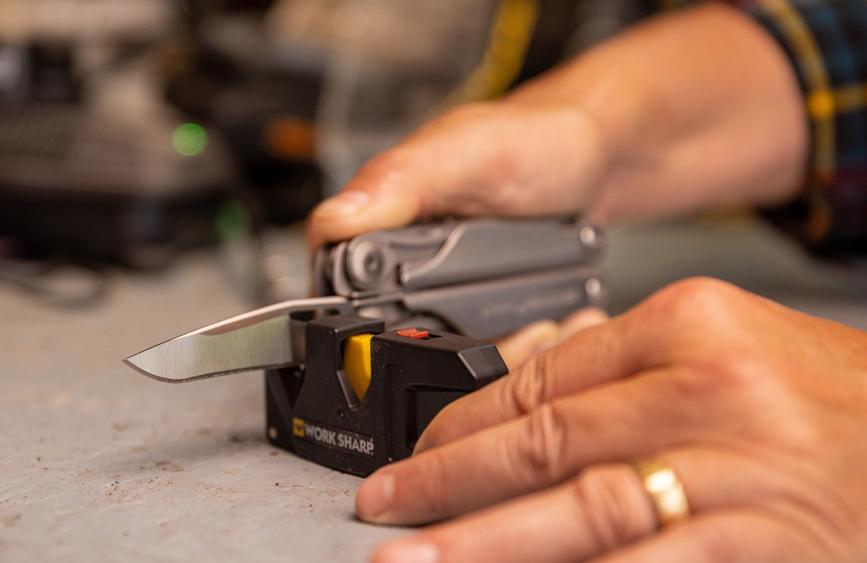 Translation missing: en.Man sharpening Leatherman Surge with Leatherman Blade Sharpener