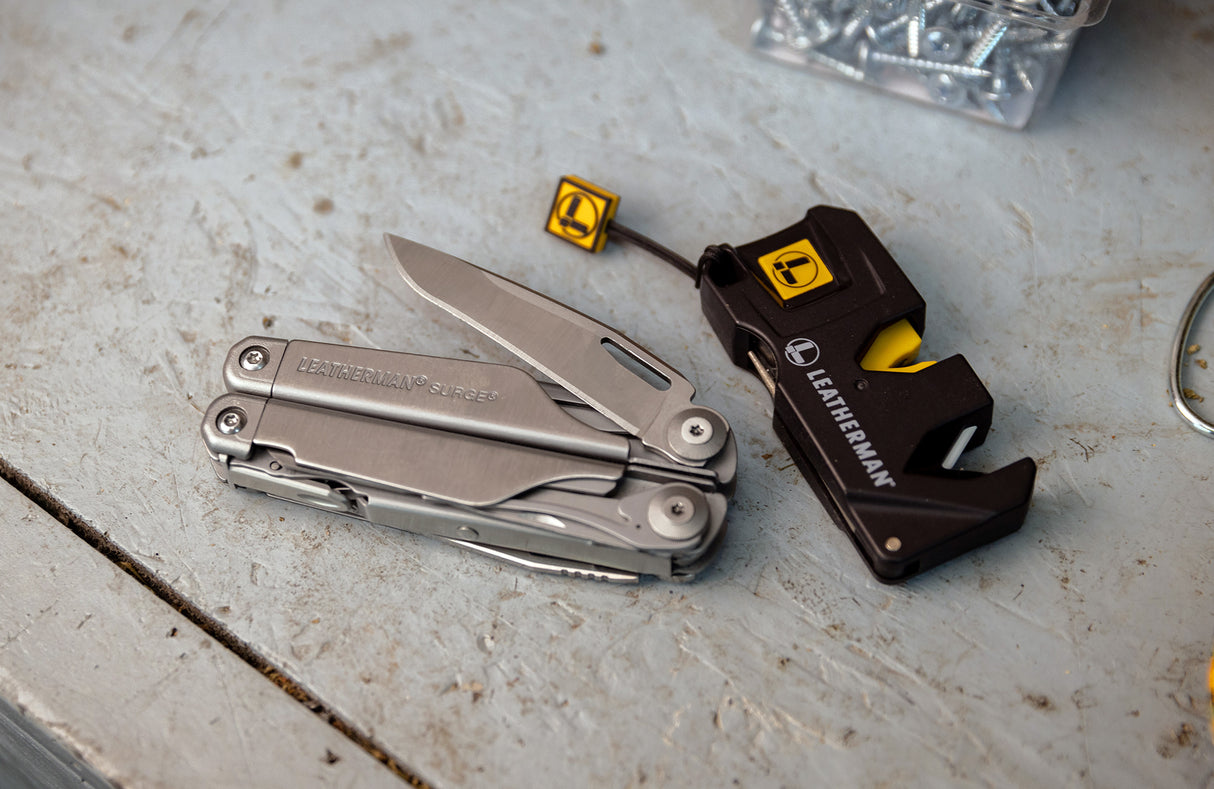 Translation missing: en.Leatherman Surge with blade opened next to Leatherman Blade Sharpener