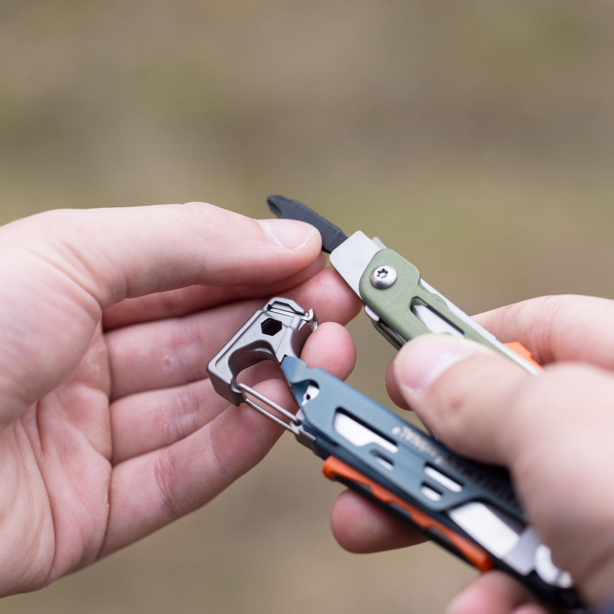 Translation missing: en.A person inserting a bit into the bit driver of a Tundrascape Leatherman Signal®