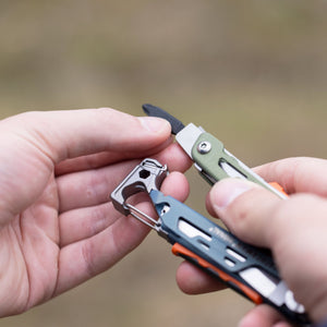 Translation missing: en.A person inserting a bit into the bit driver of a Tundrascape Leatherman Signal®