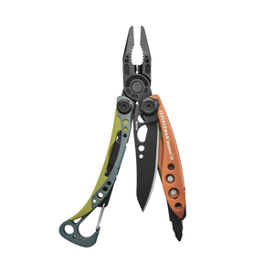 Translation missing: en.Leatherman Skeletool Cx Aurora multitool open with pliers, knife blade, and bit driver visible